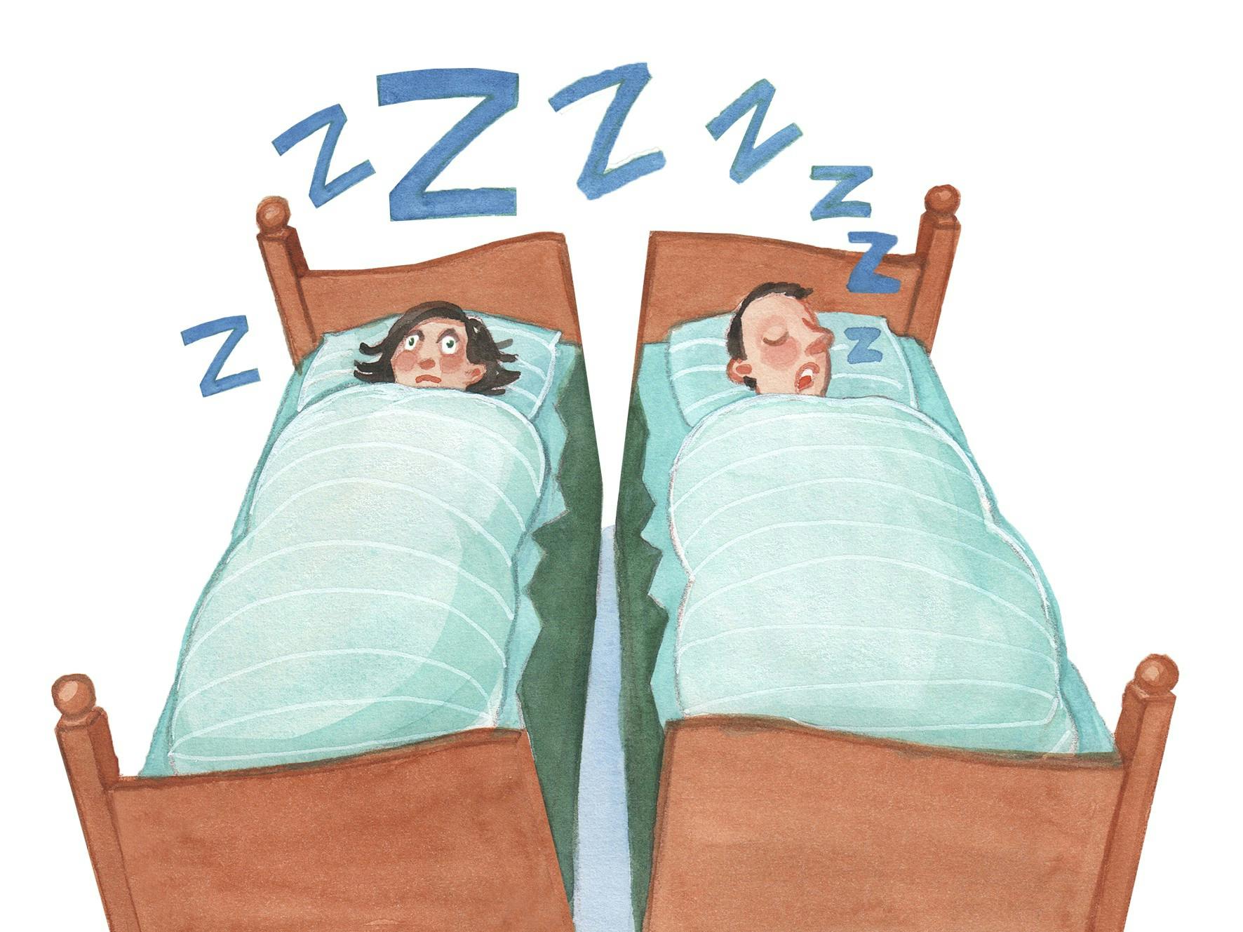 Kvinde og mand der sover i en seng