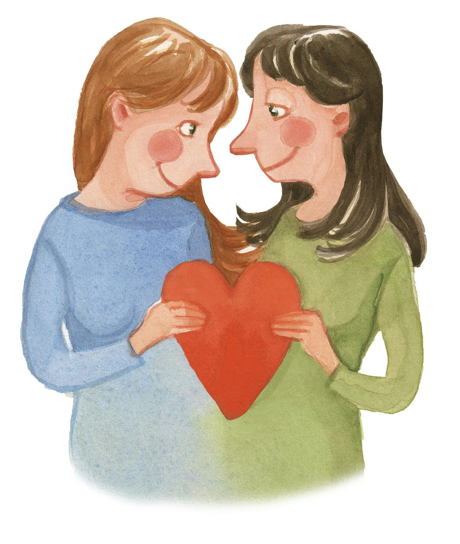 2 piger, som kigger på hinanden og holder et hjerte