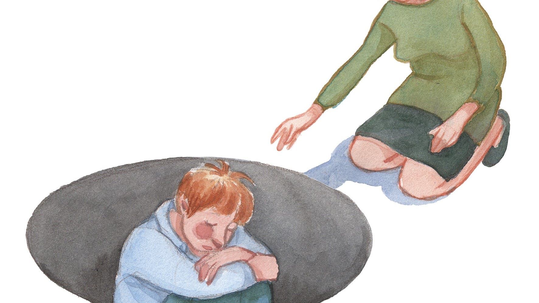 Et barn, der sidder i et huld og ser trist ud