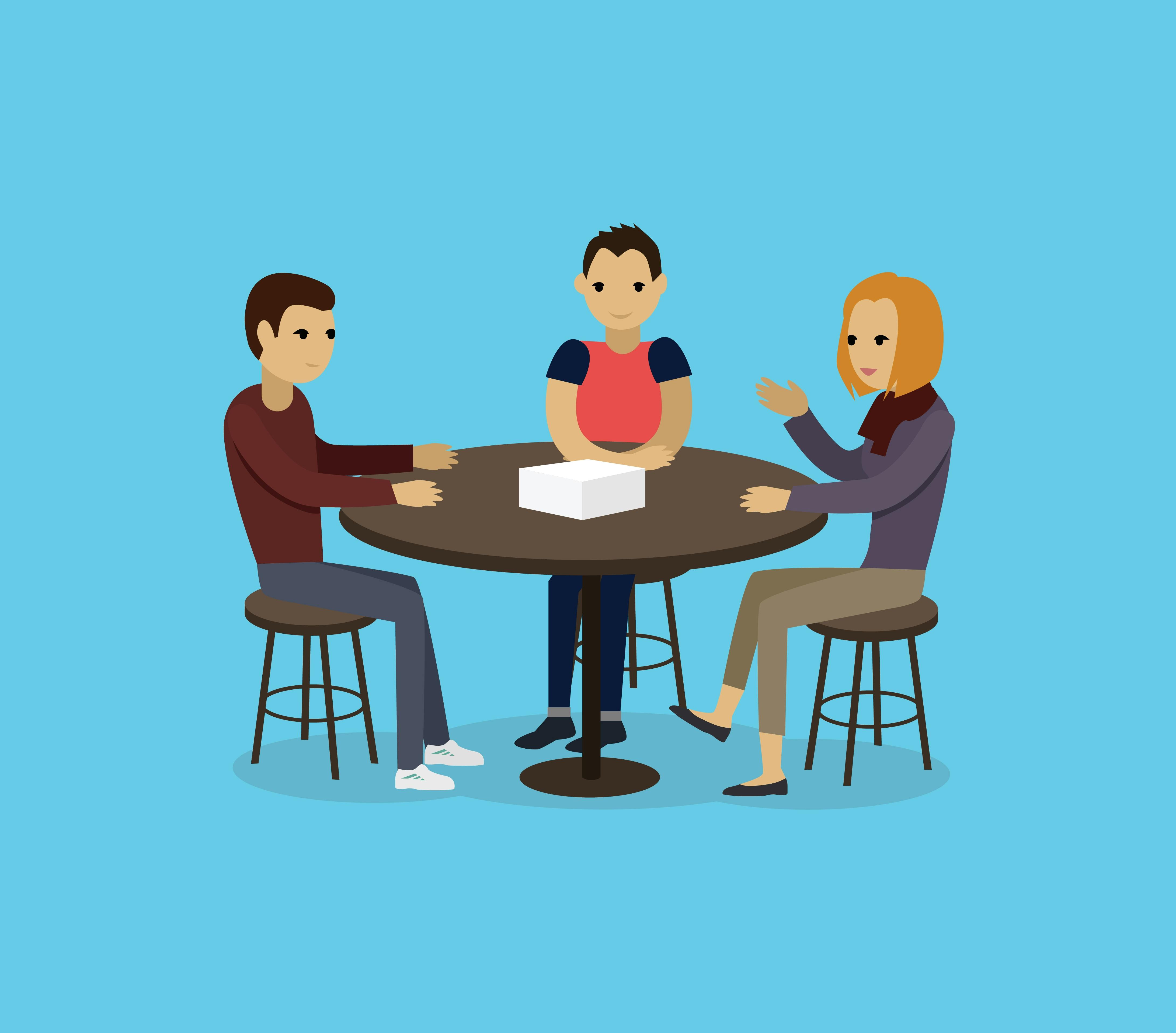 Tre personer sidder rund om et bord
