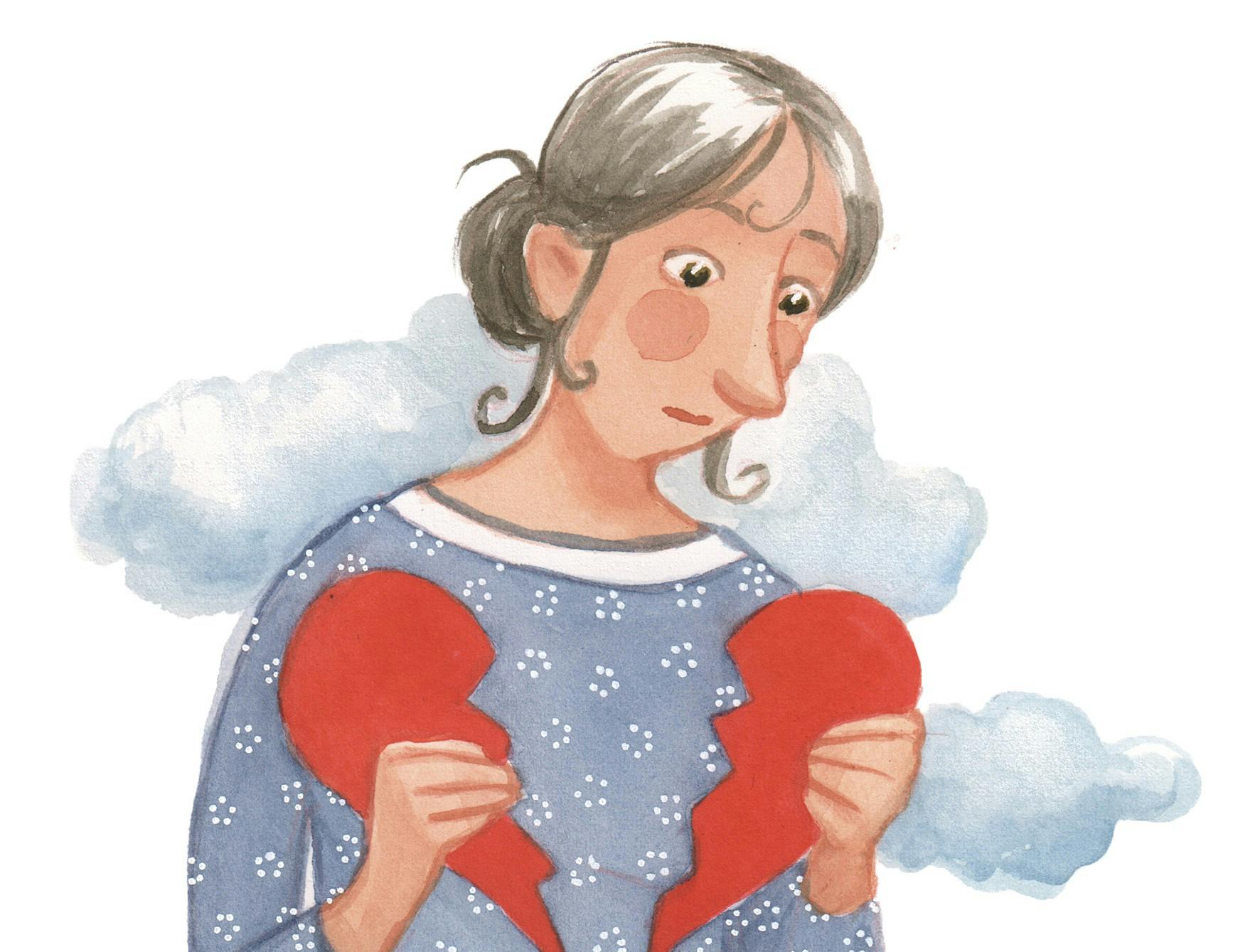 Kvinde holder et knust hjerte