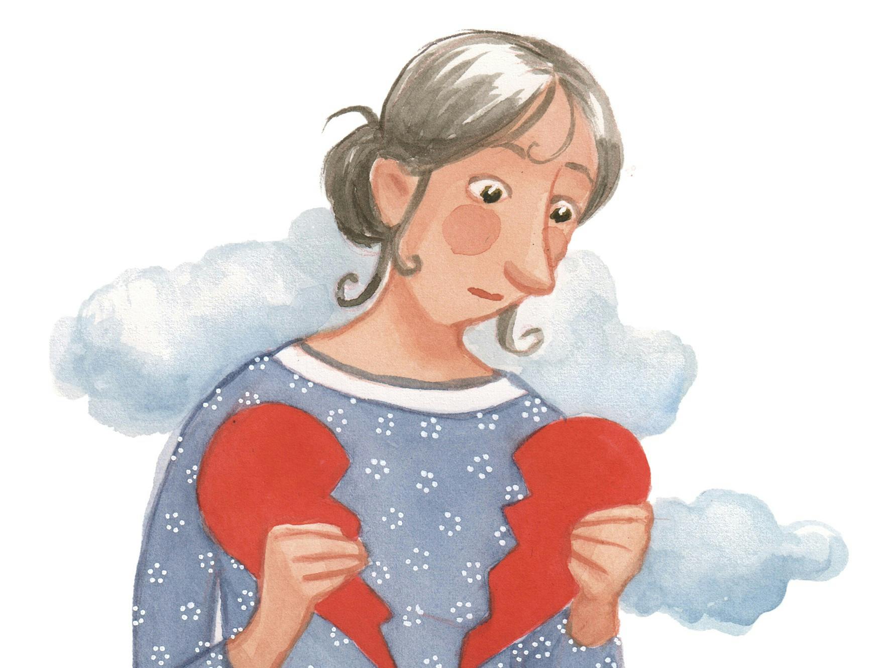 Kvinde holder et knust hjerte