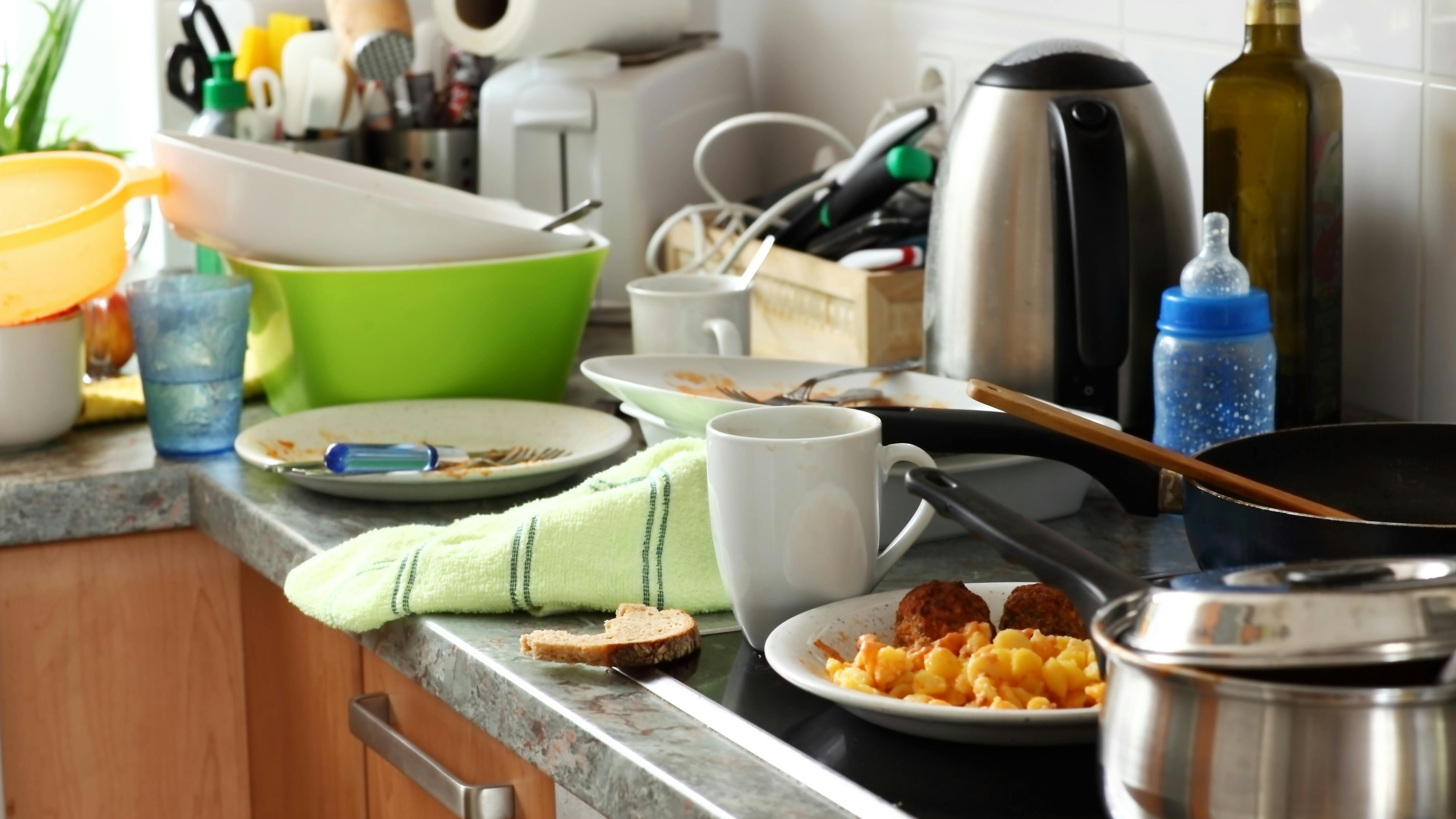 Pile of dirty dishes in the kitchen - Compulsive Hoarding Syndrom