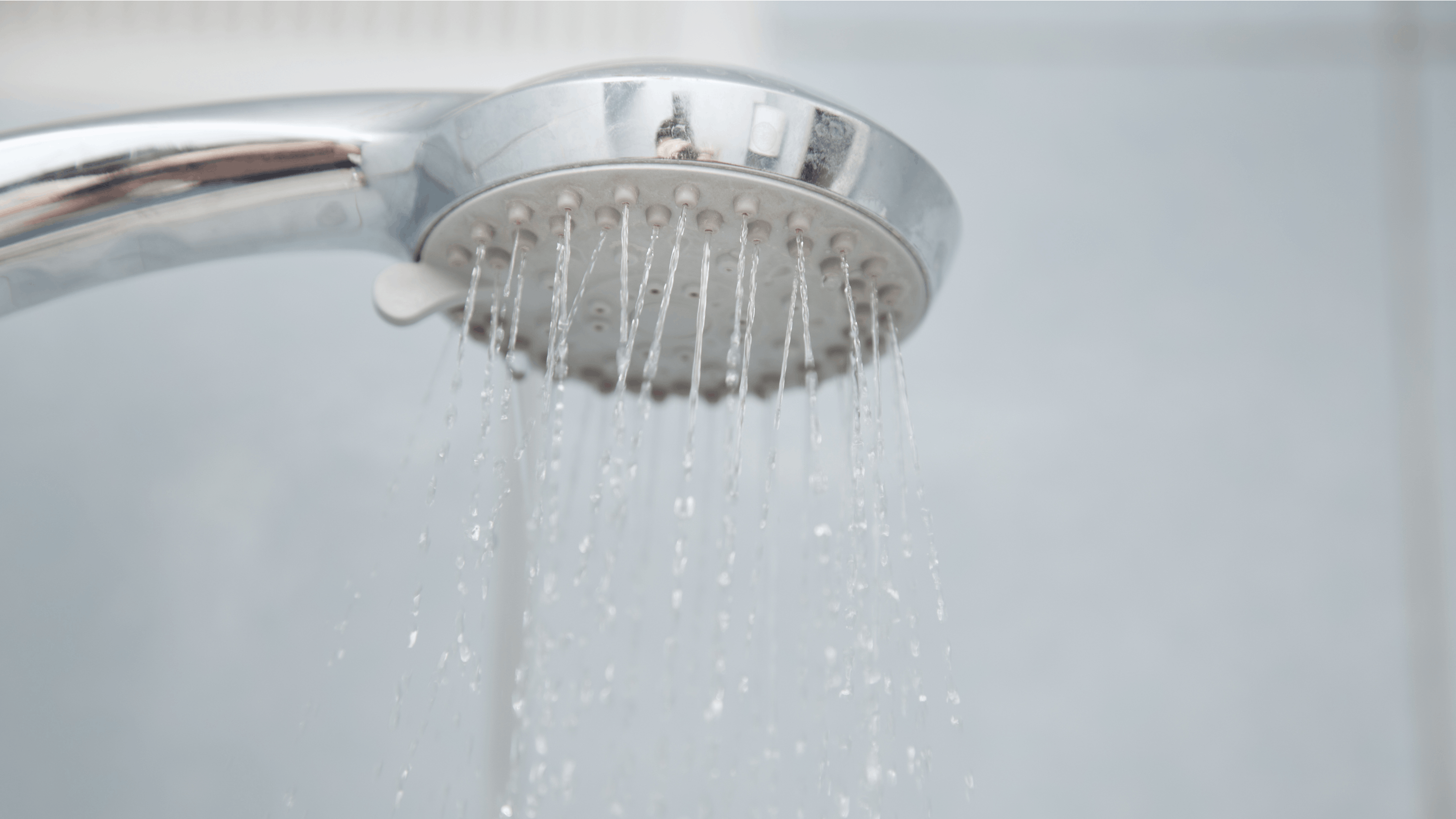 Shower in bathroom with water flowing