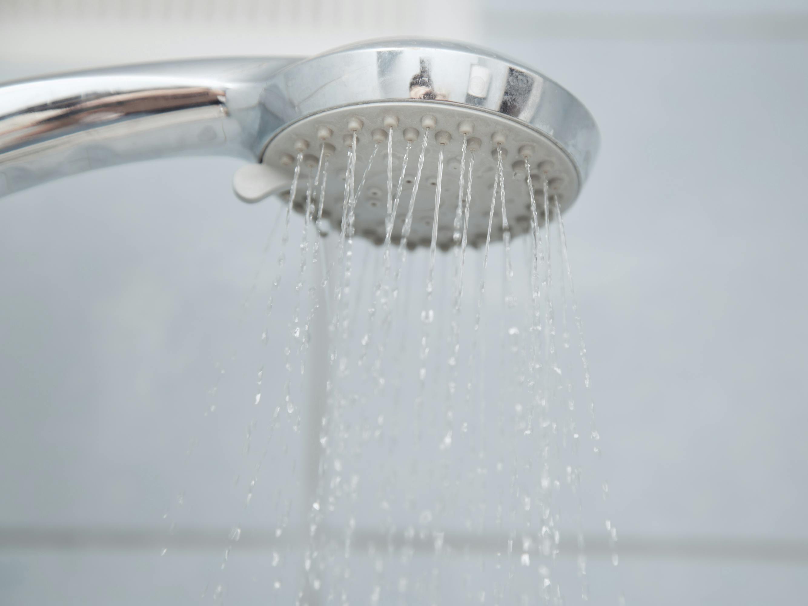 Shower in bathroom with water flowing