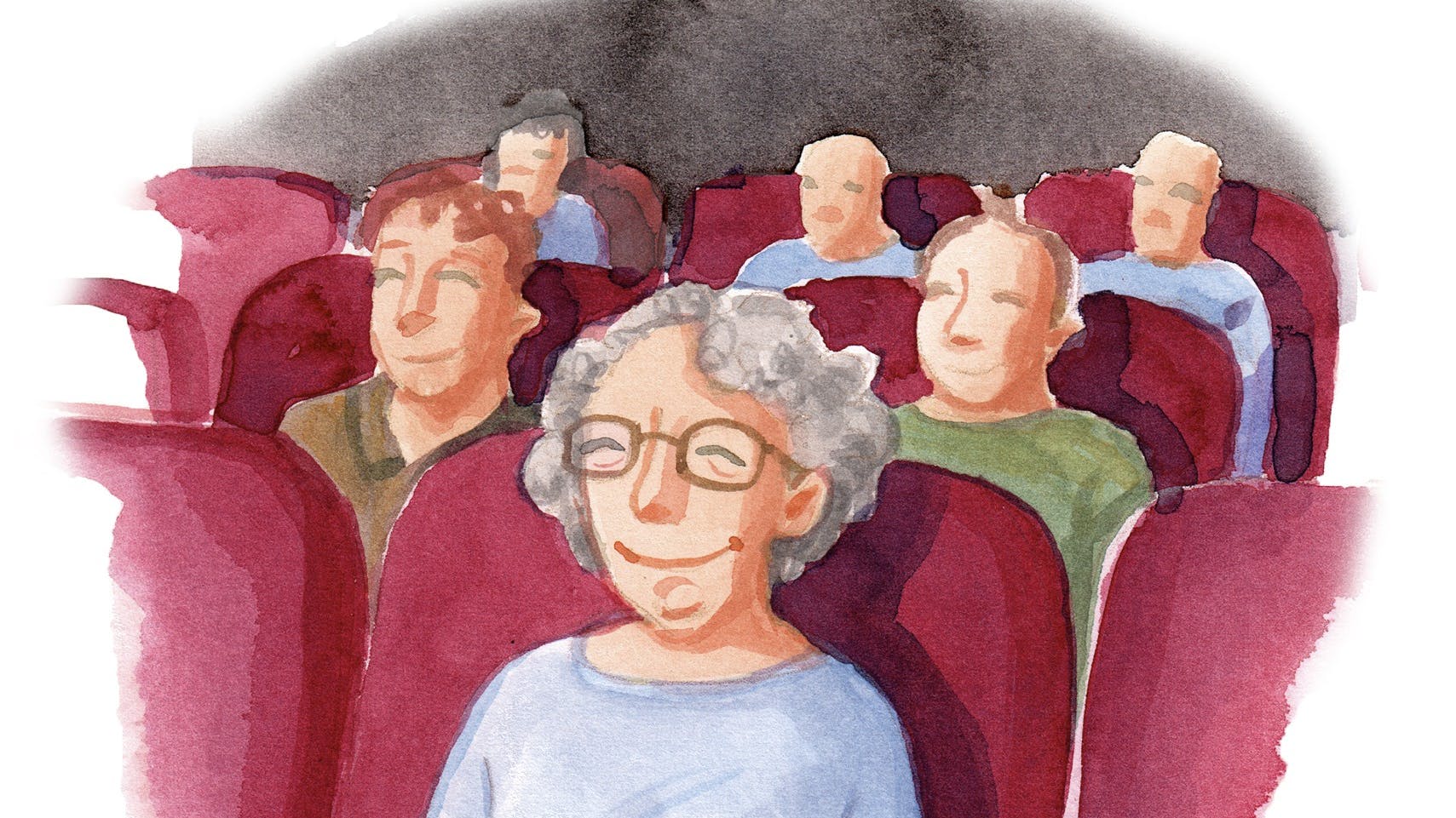 Kvinde der siddder i biografen.