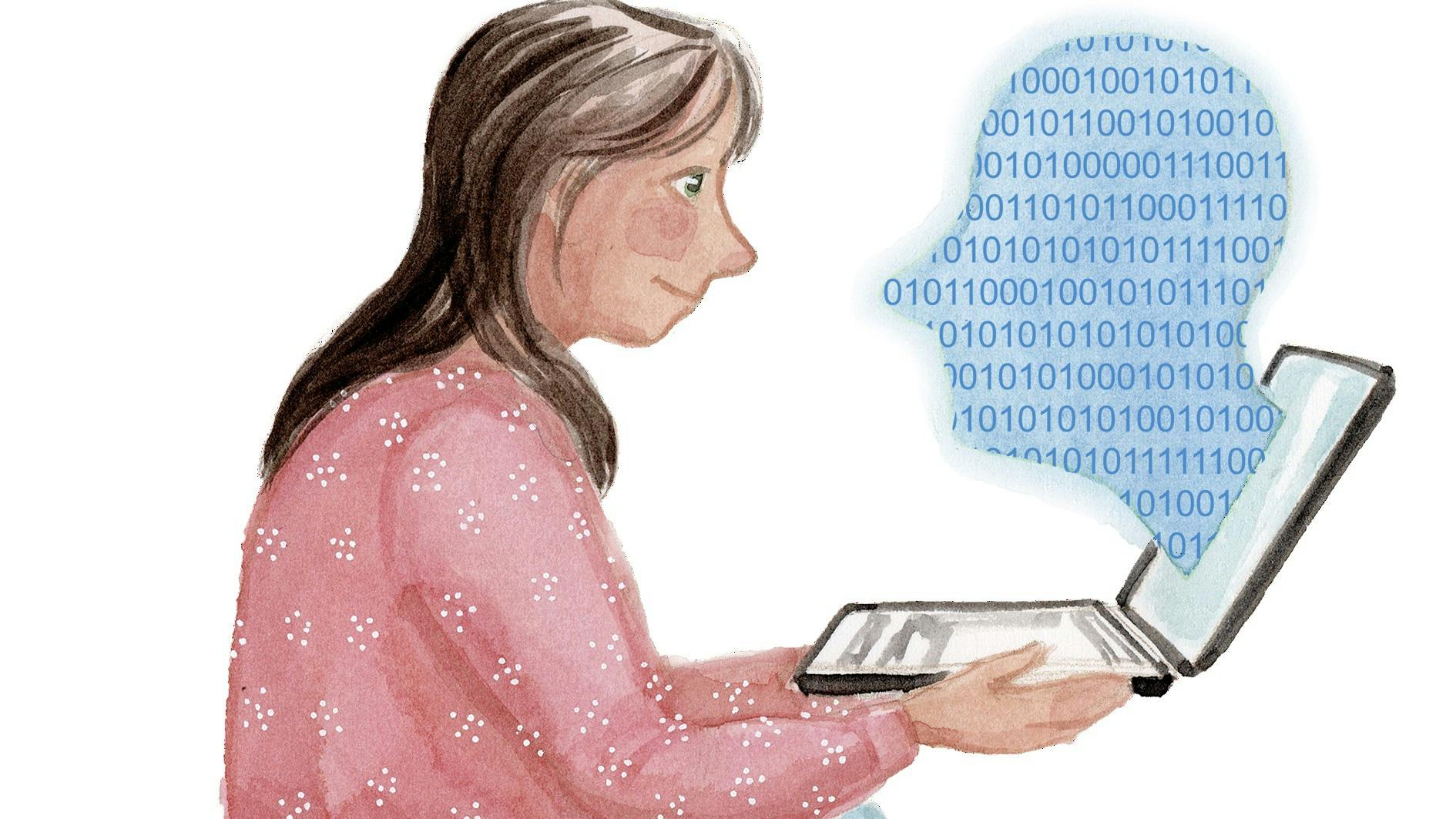 En kvinde der sidder og kigger ind på en computer.