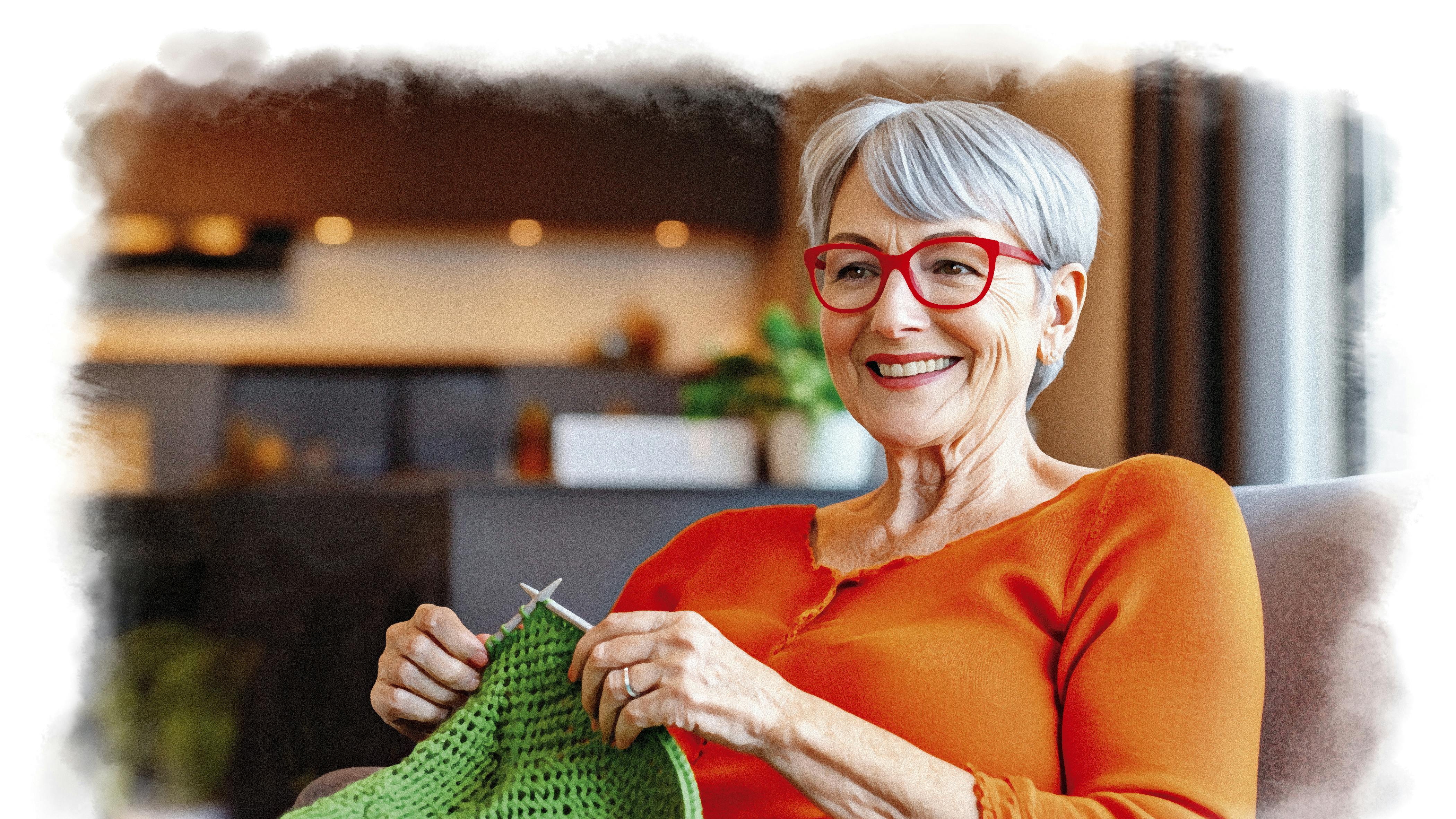 Kvinde i orange trøje strikker