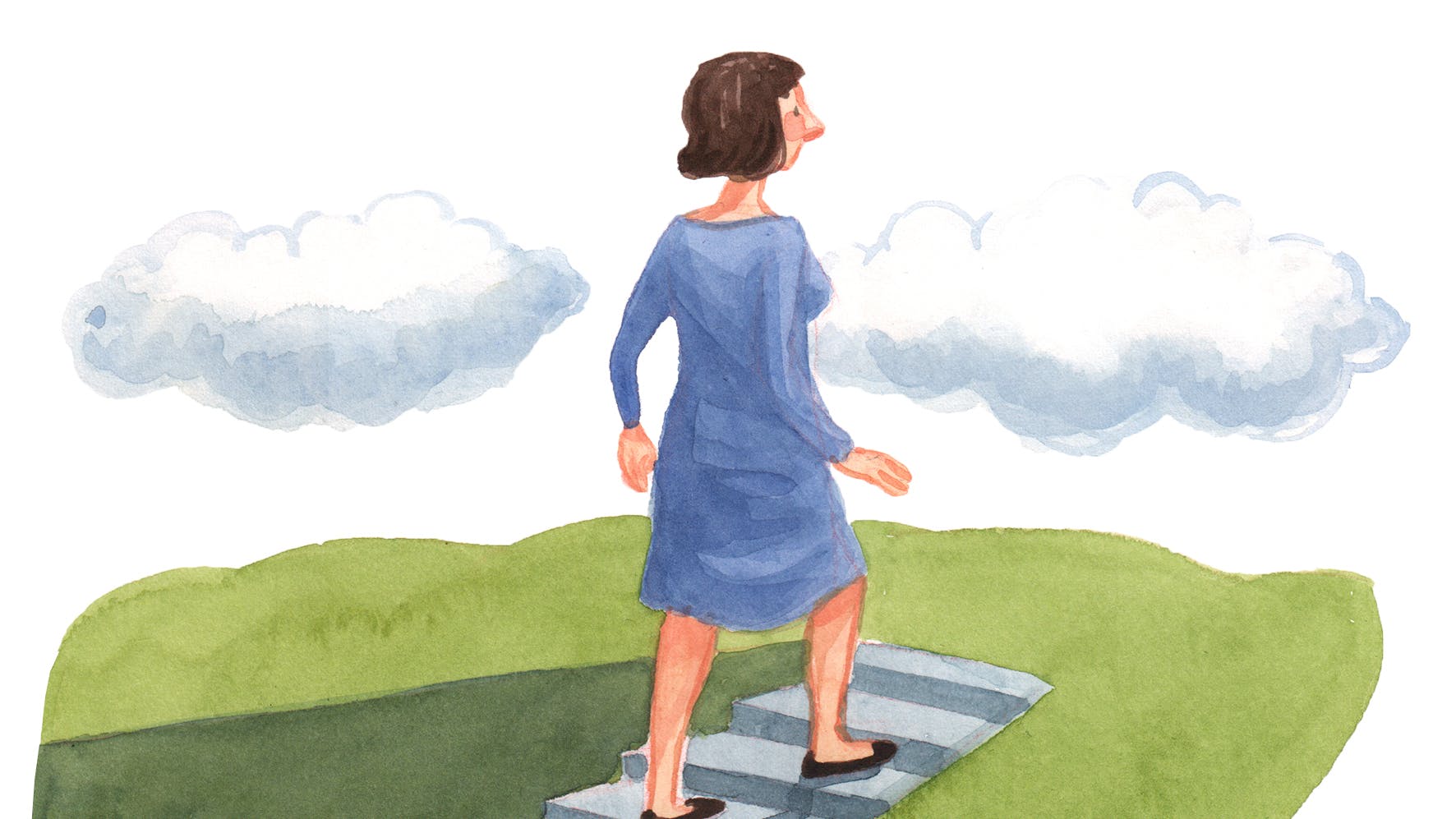 Kvinde, der går alene op ad en trappe.