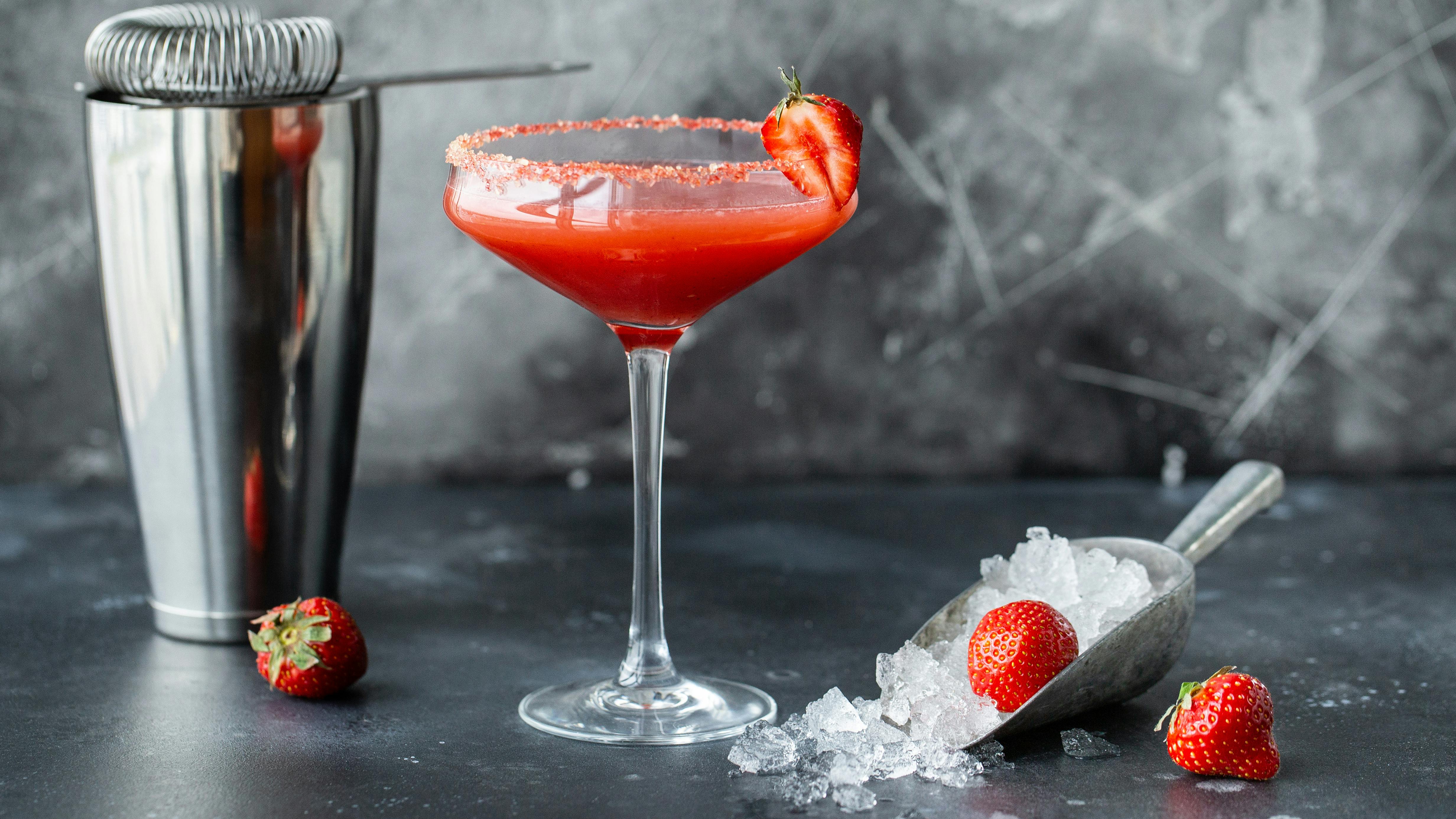 Strawberry cocktail with ice. Drink making bar tools and shaker