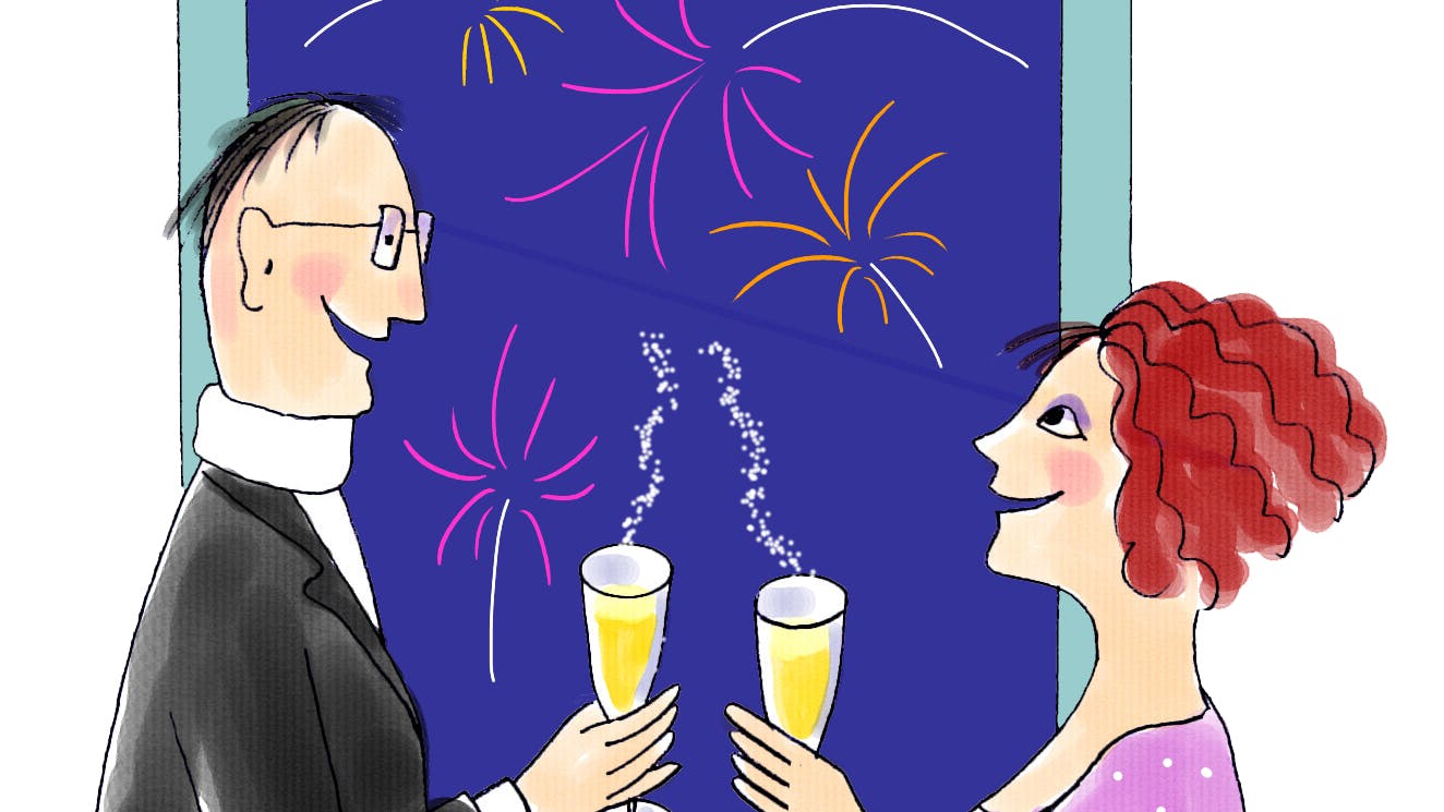 En mand og kvinde der fejre nytårsaften.